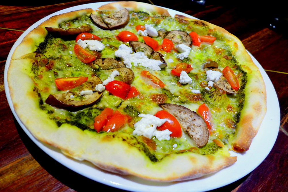 Pizza Vegetali RM27 Grilled eggplant, roasted cherry tomato, pinenut, pesto, ricotta cheese, tomato & mozzarella.