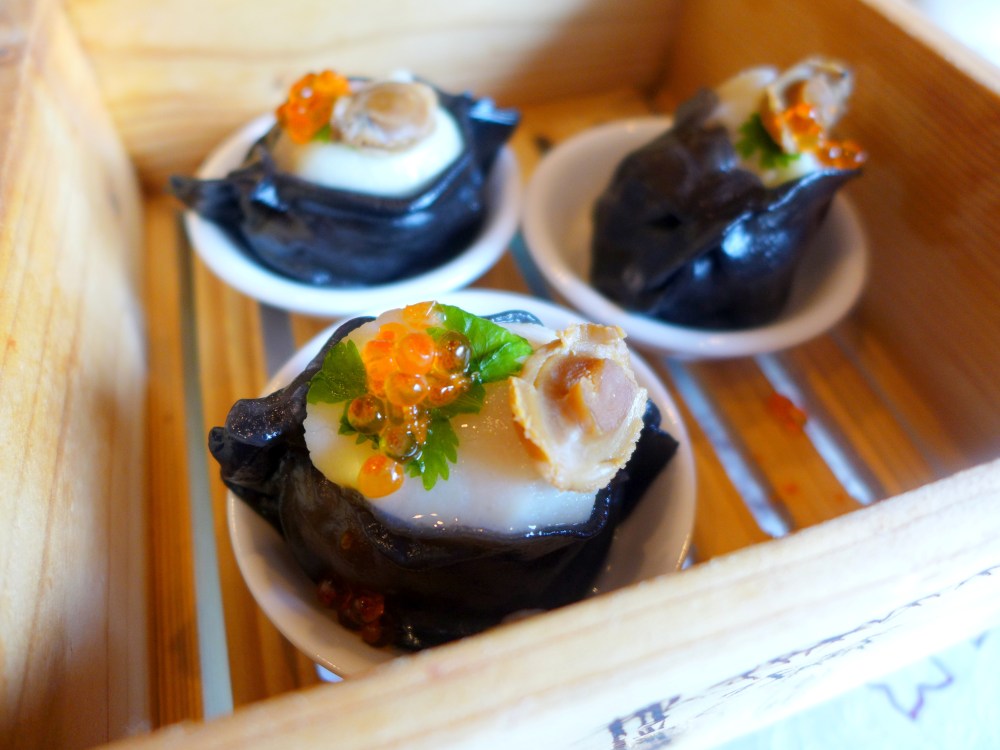Squid Ink Scallop Dumpling topped with Salmon Roe