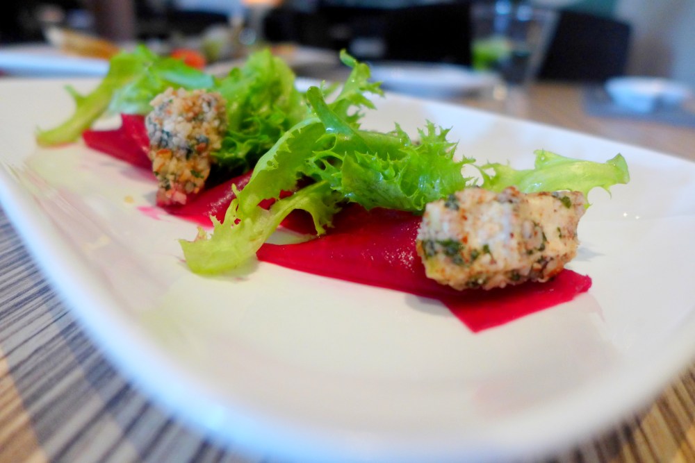 Carpaccio of pickled beetroot, wild baby rocket, toasted shaved almond, goats cheese